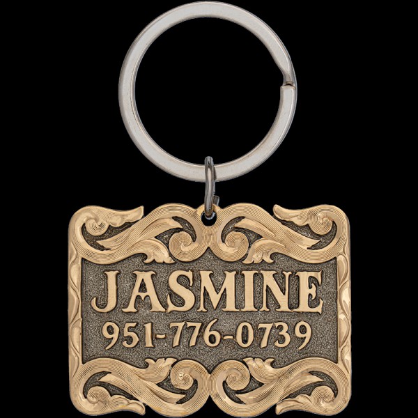 Introducing the Jasmine Custom Dog Tag! Crafted from a durable German Silver base  adorned with intricate jeweler's bronze letters and scrollwork. Order now!